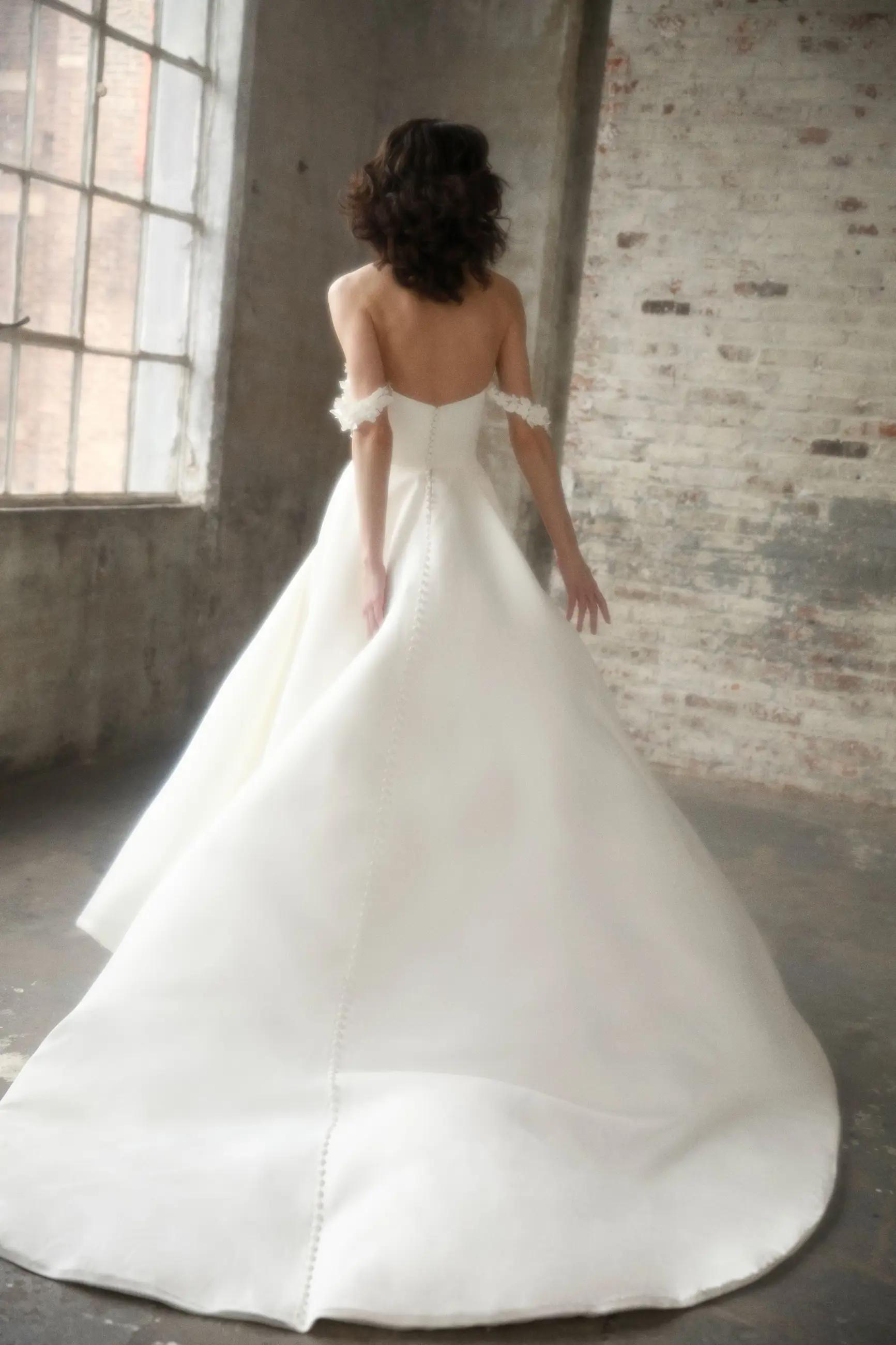 Model wearing Bobbie wedding dress by Justin Alexander Signature
