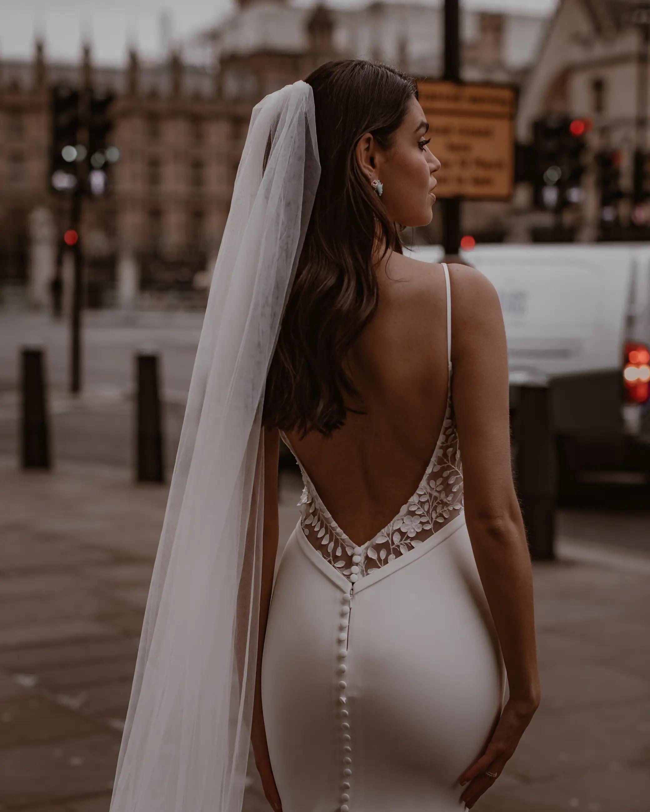 Model wearing style 'Valley' wedding dress from Made With Love