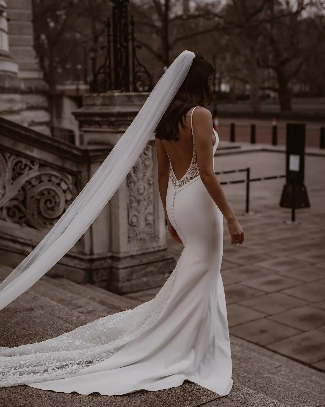 Model wearing style 'Valley' wedding dress from Made With Love