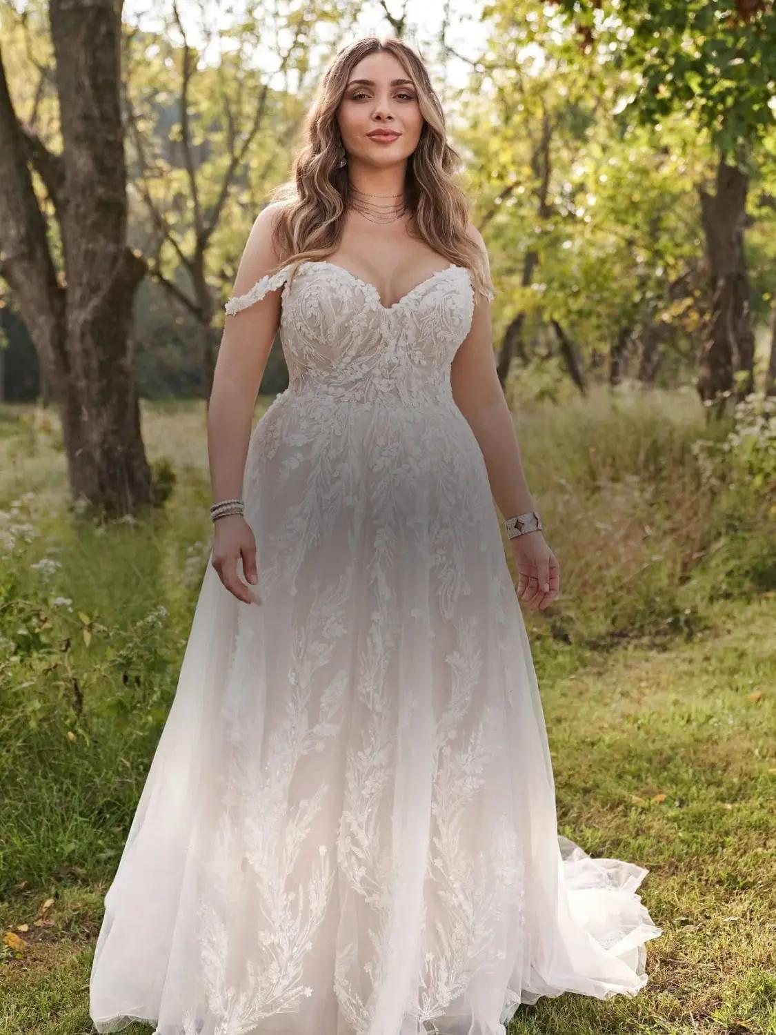 Plus size models wearing a white gown. Mobile image